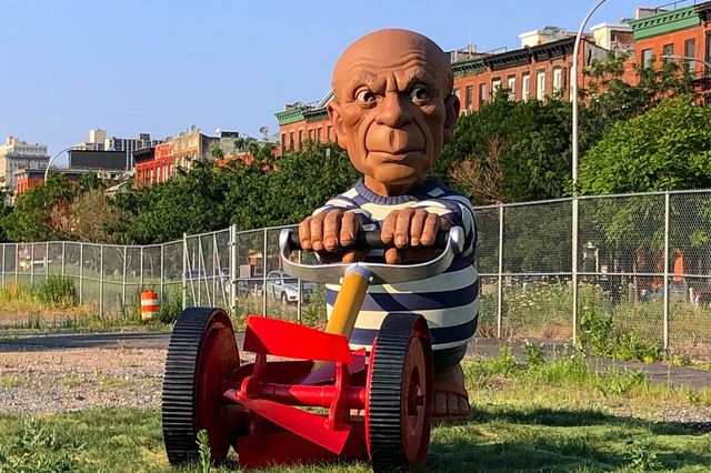 The Spanish Gardener by Elliott Arkin. A 10-ft tall depiction of  Pablo Picasso mowing the lawn, located on Columbia Street in Brooklyn.